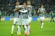 TURIN, ITALY - DECEMBER 15: Carlos Tevez (R) of Juventus celebrates his third goal with team-mates Arturo Vidal (L) and Mauricio Isla (C) during the Serie A match between Juventus and US Sassuolo Calcio at Juventus Arena on December 15, 2013 in Turin, Italy. (Photo by Valerio Pennicino/Getty Images)