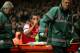 LONDON, ENGLAND - JANUARY 04: The injured Theo Walcott of Arsenal makes a 2-0 gesture to the Tottenham fans as he is stretchered off the pitch during the Budweiser FA Cup third round match between Arsenal and Tottenham Hotspur at Emirates Stadium on January 4, 2014 in London, England. (Photo by Clive Rose/Getty Images)