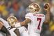 Dec 16, 2012; Foxboro, Massachusetts, USA; San Francisco 49ers quarterback Colin Kaepernick (7) passes the ball against The New England Patriots during the fourth quarter at Gillette Stadium. The San Francisco 49ers won 41-34. Mandatory Credit: Greg M. Cooper-USA TODAY Sports