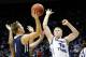 Jan 4, 2014; Provo, UT, USA; San Diego Toreros guard Johnny Dee (1) shoots the ball while Brigham Young Cougars forward Eric Mika (00) tries to block the shot during the first half at Marriott Center. Mandatory Credit: Chris Nicoll-USA TODAY Sports