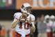 DEKALB, IL - NOVEMBER 13: Quarterback Keith Wenning #10 of the Ball State Cardinals drops back to pass during the second quarter against the Northern Illinois Huskies at Huskie Stadium on November 13, 2013 in DeKalb, Illinois. (Photo by Brian Kersey/Getty Images)