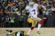 Jan 5, 2014; Green Bay, WI, USA; San Francisco 49ers quarterback Colin Kaepernick (7) runs with the ball past Green Bay Packers cornerback Davon House (31) in the second quarter during the 2013 NFC wild card playoff football game at Lambeau Field. Mandatory Credit: Benny Sieu-USA TODAY Sports