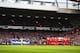 LIVERPOOL, ENGLAND - JANUARY 05: The teams stand for a minutes silence in memory of former Liverpool and Oldham player Wayne Harrison, who died on Christmas day at the age of 46 during the Budweiser FA Cup third round match between Liverpool and Oldham Athletic at Anfield on January 5, 2014 in Liverpool, England. (Photo by Clive Mason/Getty Images)