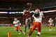 MIAMI GARDENS, FL - JANUARY 03: Vonn Bell #11 of the Ohio State Buckeyes intercepts a pass thrown by Tajh Boyd #10 of the Clemson Tigers in the second quarter during the Discover Orange Bowl at Sun Life Stadium on January 3, 2014 in Miami Gardens, Florida. (Photo by Streeter Lecka/Getty Images)