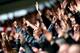 SOUTHAMPTON, ENGLAND - DECEMBER 22: Fans cheer on their team during the Barclays Premier League match between Southampton and Tottenham Hotspur at St Mary's Stadium on December 22, 2013 in Southampton, England. (Photo by Paul Gilham/Getty Images)