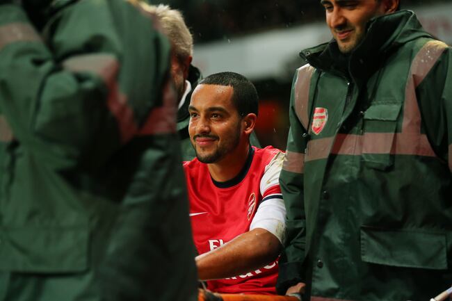 Hi-res-460557859-the-injured-theo-walcott-of-arsenal-smiles-to-himself_crop_north