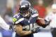 Dec 22, 2013; Seattle, WA, USA; Seattle Seahawks running back Marshawn Lynch (24) rushes against the Arizona Cardinals during the third quarter at CenturyLink Field. Mandatory Credit: Joe Nicholson-USA TODAY Sports