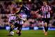 SUNDERLAND, ENGLAND - JANUARY 07: Adnan Januzaj of Manchester United is challenged by Phil Bardsley of Sunderland as Sebastian Larsson of Sunderland (R) looks on during the Capital One Cup Semi-Final, first leg match between Sunderland and Manchester United at Stadium of Light on January 7, 2014 in Sunderland, England. (Photo by Laurence Griffiths/Getty Images)