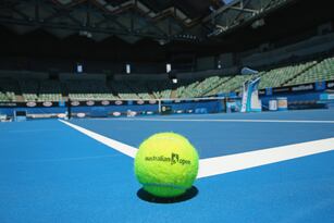 Hi-res-460656969-an-australian-open-tennis-ball-rests-on-the-court-of_crop_north