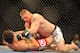LAS VEGAS - JULY 11: Brock Lesnar holds down Frank Mir during their heavyweight title bout during UFC 100 on July 11, 2009 in Las Vegas, Nevada. Lesnar defeated Mir by a second round knockout. (Photo by Jon Kopaloff/Getty Images)