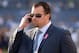 Oct 14, 2013; San Diego, CA, USA; Indianapolis Colts general manager Ryan Grigson talks on a cell phone before the game against the San Diego Chargers at Qualcomm Stadium. Mandatory Credit: Kirby Lee-USA TODAY Sports