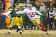 Jan 5, 2014; Green Bay, WI, USA; San Francisco 49ers linebacker Ahmad Brooks (55) chases Green Bay Packers quarterback Aaron Rodgers (12) during the third quarter of the 2013 NFC wild card playoff football game at Lambeau Field. Mandatory Credit: Jeff Hanisch-USA TODAY Sports