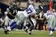 Dec 29, 2013; Arlington, TX, USA; Dallas Cowboys defensive tackle Jason Hatcher (97) hits Philadelphia Eagles quarterback Nick Foles (9) and causes a fumble in the third quarter at AT&T Stadium. Mandatory Credit: Tim Heitman-USA TODAY Sports