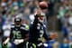 SEATTLE - DECEMBER 29: Quarterback Russell Wilson #3 of the Seattle Seahawks throws a pass against the St. Louis Rams on December 29, 2013 at CenturyLink Field in Seattle, Washington. (Photo by Jonathan Ferrey/Getty Images)