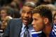 Oct 7, 2013; Portland, OR, USA; Los Angeles Clippers head coach Doc Rivers speaks with power forward Blake Griffin (32) on the bench during the second quarter of the game against the Portland Trail Blazers at Moda Center. Mandatory Credit: Steve Dykes-USA TODAY Sports