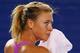 MELBOURNE, AUSTRALIA - JANUARY 06: Maria Sharapova of Russia wipes sweat of her face during practice ahead of the 2014 Australian Open at Melbourne Park on January 6, 2014 in Melbourne, Australia. (Photo by Michael Dodge/Getty Images)