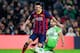 BARCELONA, SPAIN - JANUARY 08: Lionel Messi of FC Barcelona duels for the ball with Mehdi Lacen of Getafe CF during the Copa del Rey round of 16 first leg match between FC Barcelona and Getafe CF at Camp Nou on January 8, 2014 in Barcelona, Spain. (Photo by David Ramos/Getty Images)