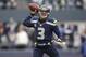 Dec 29, 2013; Seattle, WA, USA; Seattle Seahawks quarterback Russell Wilson (3) throws the ball against the St. Louis Rams during the third quarter at CenturyLink Field. Mandatory Credit: Joe Nicholson-USA TODAY Sports
