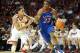 Jan 8, 2014; Norman, OK, USA; Kansas Jayhawks guard Andrew Wiggins (22) handles the ball while being guarded by Oklahoma Sooners guard Isaiah Cousins (11) during the first half at Lloyd Noble Center. Mandatory Credit: Mark D. Smith-USA TODAY Sports