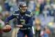 SEATTLE, WA - DECEMBER 29: Quarterback Russell Wilson #3 of the Seattle Seahawks looks downfield to pass against the St. Louis Rams at CenturyLink Field on December 29, 2013 in Seattle, Washington. (Photo by Otto Greule Jr/Getty Images)