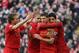 LIVERPOOL, ENGLAND - FEBRUARY 17: Steven Gerrard of Liverpool celebrates with Luis Suarez,Glen Johnson and Lucas after scoring the first goal from the penalty spot during the Barclays Premier League match between Liverpool and Swansea City at Anfield on February 17, 2013 in Liverpool, England. (Photo by Clive Brunskill/Getty Images)