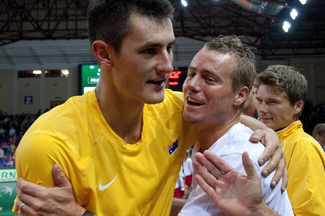 Hi-res-180495194-bernard-tomic-and-lleyton-hewitt-of-australia-celebrate_crop_north