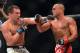 Nov 2, 2013; Long Beach, CA, USA; Eddie Alvarez (red gloves) and Michael Chandler (blue gloves) during their Bellator lightweight world championship fight at the Long Beach Arena. Alvarez won the fight. Mandatory Credit: Jayne Kamin-Oncea-USA TODAY Sports