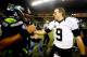 SEATTLE, WA - DECEMBER 02: Quarterback Russell Wilson #3 of the Seattle Seahawks and quarterback Drew Brees #9 of the New Orleans Saints meet on the field after the Seattle Seahawks defeated the New Orleans Saints 34-7 in a game at CenturyLink Field on December 2, 2013 in Seattle, Washington. (Photo by Jonathan Ferrey/Getty Images)