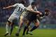 LONDON, ENGLAND - DECEMBER 12: Matt Janney of Oxford University is tackled by Andy Murdoch and Scott Annett of Cambridge Universityduring the Varsity Match between Oxford University and Cambridge University at Twickenham Stadium on December 12, 2013 in London, England. (Photo by Bryn Lennon/Getty Images)