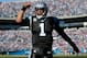 CHARLOTTE, NC - JANUARY 12: Cam Newton #1 of the Carolina Panthers celebrates after a touchdown pass to Steve Smith #89 in the second quarter against the San Francisco 49ers during the NFC Divisional Playoff Game at Bank of America Stadium on January 12, 2014 in Charlotte, North Carolina. (Photo by Kevin C. Cox/Getty Images)