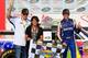 Chase Elliott (far right) celebrated his first truck series victory with dad Bill (far left) and mom Cindy (middle).