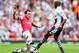 LONDON, ENGLAND - AUGUST 17: Santi Cazorla of Arsenal and Fabian Delph of Aston Villa battle for the ball during the Barclays Premier League match between Arsenal and Aston Villa at Emirates Stadium on August 17, 2013 in London, England. (Photo by Clive Mason/Getty Images)