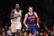 Dec 5, 2013; Brooklyn, NY, USA; New York Knicks power forward Andrea Bargnani (77) has words with Brooklyn Nets power forward Kevin Garnett (2) as they run up the court after Bargnani hits a three-point basket during the fourth quarter of a game at Barclays Center. Bargnani was immediately issues a second technical foul and ejected from the game. Mandatory Credit: Brad Penner-USA TODAY Sports