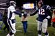 FOXBORO, MA - NOVEMBER 24: Quarterback Peyton Manning #18 of the Denver Broncos and quarterback Tom Brady #12 of the New England Patriots shake hands after the New England Patriots defeated the Denver Broncos 34-31 in overtime at Gillette Stadium on November 24, 2013 in Foxboro, Massachusetts. (Photo by Jim Rogash/Getty Images)