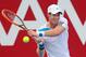 MELBOURNE, AUSTRALIA - JANUARY 10: Andy Murray of Great Britain plays a backhand during his match against Lleyton Hewitt of Australia during day three of the AAMI Classic at Kooyong on January 10, 2014 in Melbourne, Australia. (Photo by Scott Barbour/Getty Images)