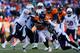 DENVER, CO - JANUARY 12: Knowshon Moreno #27 of the Denver Broncos is tackled in the second quarter against the San Diego Chargers during the AFC Divisional Playoff Game at Sports Authority Field at Mile High on January 12, 2014 in Denver, Colorado. (Photo by Justin Edmonds/Getty Images)
