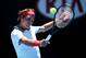 MELBOURNE, AUSTRALIA - JANUARY 14: Roger Federer of Switzerland plays a backhand in his first round match against James Duckworth of Australia during day two of the 2014 Australian Open at Melbourne Park on January 14, 2014 in Melbourne, Australia. (Photo by Clive Brunskill/Getty Images)