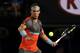 MELBOURNE, AUSTRALIA - JANUARY 14: Rafael Nadal of Spain plays a forehand in his first round match against Bernard Tomic of Australia during day two of the 2014 Australian Open at Melbourne Park on January 14, 2014 in Melbourne, Australia. (Photo by Clive Brunskill/Getty Images)