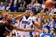 Jabari Parker and Virginia's Akil Mitchell fight for the ball Monday night.