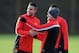MANCHESTER, ENGLAND - DECEMBER 09: Wayne Rooney of Manchester United shares a laugh with team-mate Robin Van Persie during a first team training session, ahead of their UEFA Champions League Group A match against Shakhtar Donetsk, at Aon Training Complex on December 09, 2013 in Manchester, England. (Photo by Chris Brunskill/Getty Images)