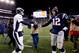 FOXBORO, MA - NOVEMBER 24: Quarterback Peyton Manning #18 of the Denver Broncos and quarterback Tom Brady #12 of the New England Patriots shake hands after the New England Patriots defeated the Denver Broncos 34-31 in overtime at Gillette Stadium on November 24, 2013 in Foxboro, Massachusetts. (Photo by Jim Rogash/Getty Images)