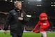 MANCHESTER, ENGLAND - JANUARY 01: Manchester United Manager David Moyes walks with mascot Fred the Red prior to the Barclays Premier League match between Manchester United and Tottenham Hotspur at Old Trafford on January 1, 2014 in Manchester, England. (Photo by Michael Regan/Getty Images)