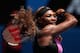 MELBOURNE, AUSTRALIA - JANUARY 15: Serena Williams of the United States plays a forehand in her second round match against Vesna Dolonc of Serbia during day three of the 2014 Australian Open at Melbourne Park on January 15, 2014 in Melbourne, Australia. (Photo by Michael Dodge/Getty Images)