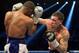 Gabe Rosado lands a shot against J'Leon Love