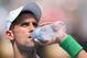 MELBOURNE, AUSTRALIA - JANUARY 15: Novak Djokovic of Serbia has a drink in his second round match against Leonardo Mayer of Argentina during day three of the 2014 Australian Open at Melbourne Park on January 15, 2014 in Melbourne, Australia. (Photo by Michael Dodge/Getty Images)