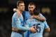 MANCHESTER, ENGLAND - JANUARY 15: Sergio Aguero of Manchester City celebrates scoring his team's fourth goal with team-mates Edin Dzeko (L) and Aleksandar Kolarov during the Budweiser FA Cup Third Round Replay match between Manchester City and Blackburn Rovers at the Etihad Stadium on January 15, 2014 in Manchester, England. (Photo by Chris Brunskill/Getty Images)