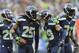 Dec 22, 2013; Seattle, WA, USA; Seattle Seahawks cornerback Richard Sherman (25) and free safety Earl Thomas (29) celebrate after Sherman intercepted the ball thrown by Arizona Cardinals quarterback Carson Palmer (not pictured) during the game at CenturyLink Field. Arizona defeated Seattle 17-10. Mandatory Credit: Steven Bisig-USA TODAY Sports