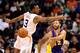 Jan 15, 2014; Phoenix, AZ, USA; Los Angeles Lakers guard Kendall Marshall (12) makes a pass around Phoenix Suns guard Ish Smith (3) in the second half at US Airways Center. The Suns won 121-114. Mandatory Credit: Jennifer Stewart-USA TODAY Sports