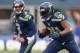 SEATTLE, WA - DECEMBER 29: Running back Marshawn Lynch #24 of the Seattle Seahawks rushes against the St. Louis Rams at CenturyLink Field on December 29, 2013 in Seattle, Washington. (Photo by Otto Greule Jr/Getty Images)
