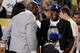 LOS ANGELES, CA - JULY 31: Kobe Bryant of the Los Angeles Lakers and Magic Johnson laugh during the game against the New York Yankees at Dodger Stadium on July 31, 2013 in Los Angeles, California. (Photo by Harry How/Getty Images)
